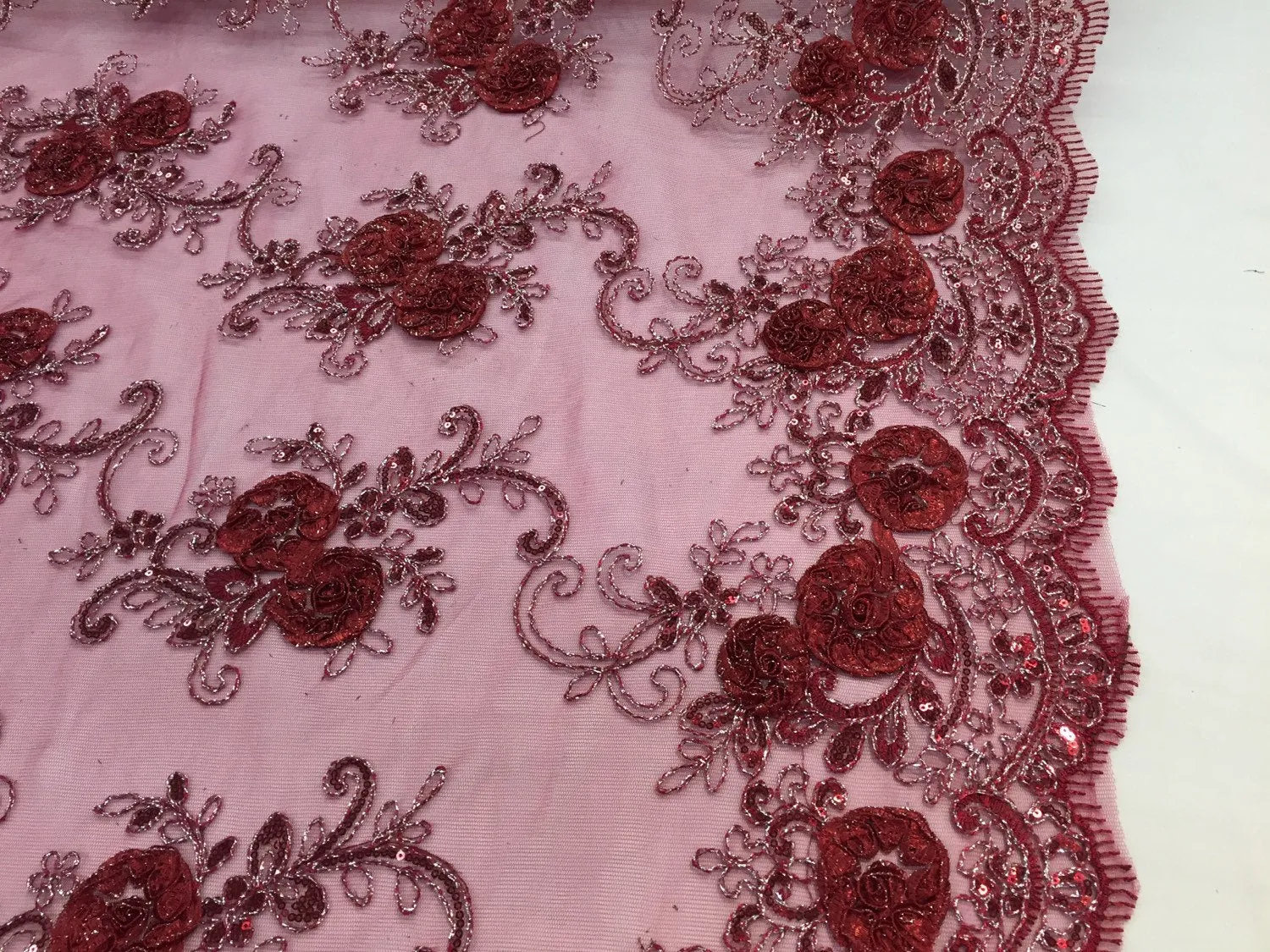 Burgundy 3d flowers embroider with sequins on a mesh lace fabric. Sold by the yard.